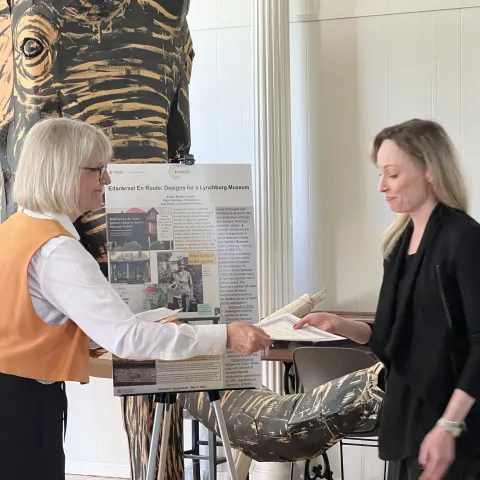 Student receives DH Certificate from FAC chair Allison Booth