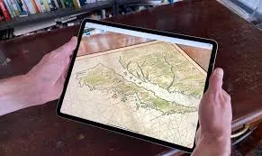 picture of someone's hands holding an ipad and using the Booksnake app